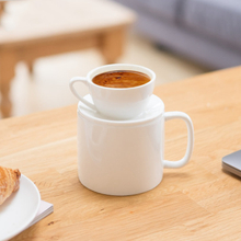 A white ceramic coffee cup that can be used on both sides